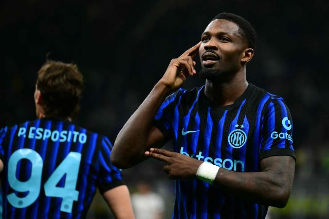 Inter Milan's French forward #9 Marcus Thuram celebrates scoring his team's first goal during the Italian Serie A football match between Inter Milan and Cagliari at San Siro stadium in Milan, on April 17, 2026. (Photo by Marco BERTORELLO / AFP)