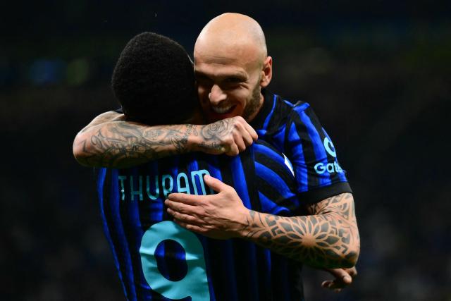 Inter Milan's French forward #9 Marcus Thuram celebrates scoring his team's first goal with Inter Milan's Italian defender #32 Federico Dimarco (R) during the Italian Serie A football match between Inter Milan and Cagliari at San Siro stadium in Milan, on April 17, 2026. (Photo by Marco BERTORELLO / AFP)