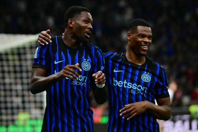 Inter Milan's French forward #9 Marcus Thuram celebrates his team's first goal with Inter Milan's Dutch defender #2 Denzel Dumfries during the Italian Serie A football match between Inter Milan and Cagliari at San Siro stadium in Milan, on April 17, 2026. (Photo by Marco BERTORELLO / AFP)