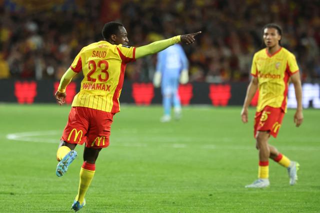 Lens' Saudi Arabian defender #23 Saud Abdulhamid celebrates after scoring his team first goal during the French L1 football match between RC Lens and Toulouse FC at the Stade Bollaert-Delelis in Lens, northern France, on April 17, 2026. (Photo by Francois LO PRESTI / AFP)