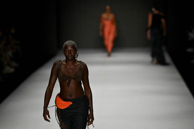 A model presents a creation by Karoline Vitto during Rio Fashion Week at Pier Maua in Rio de Janeiro, Brazil, on April 17, 2026. (Photo by Mauro PIMENTEL / AFP)