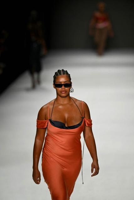 A model presents a creation by Karoline Vitto during Rio Fashion Week at Pier Maua in Rio de Janeiro, Brazil, on April 17, 2026. (Photo by Mauro PIMENTEL / AFP)