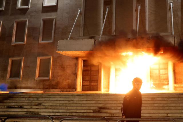 Molotov cocktails explode in front of the Prime Minister office during an anti-government protest in Tirana on April 17, 2026. (Photo by Adnan Beci / AFP)