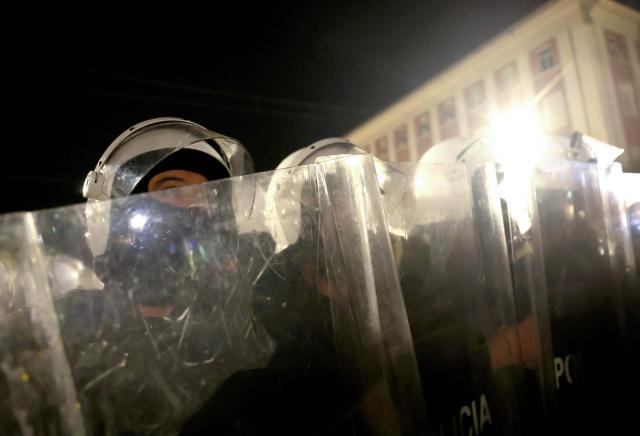 Albanian riot police officers stand by during an anti-government protest in Tirana on April 17, 2026. (Photo by Adnan Beci / AFP)