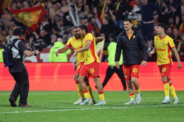 Lens' Burkinabe defender #37 Ismaelo Ganiou (C) celebrates with teammates after scoring a goal during the French L1 football match between RC Lens and Toulouse FC at the Stade Bollaert-Delelis in Lens, northern France, on April 17, 2026. (Photo by Francois LO PRESTI / AFP)