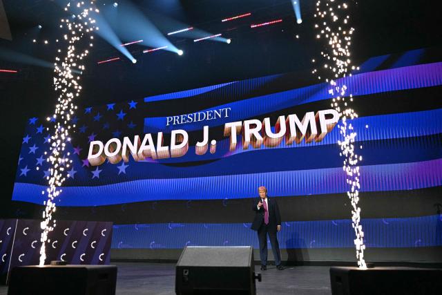 US President Donald Trump arrives on stage to address a Turning Point USA event at Dream City Church in Phoenix, Arizona, on April 17, 2026. (Photo by Jim WATSON / AFP)
