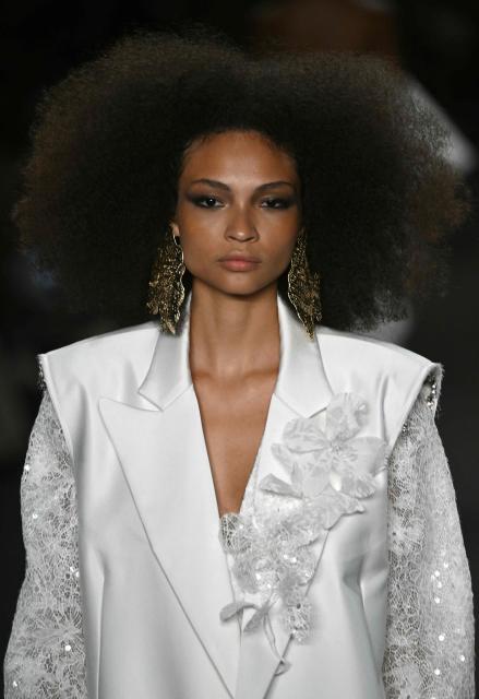 A model presents a creation by Apartamento 03 during Rio Fashion Week at Pier Maua in Rio de Janeiro, Brazil, on April 17, 2026. (Photo by Mauro PIMENTEL / AFP)