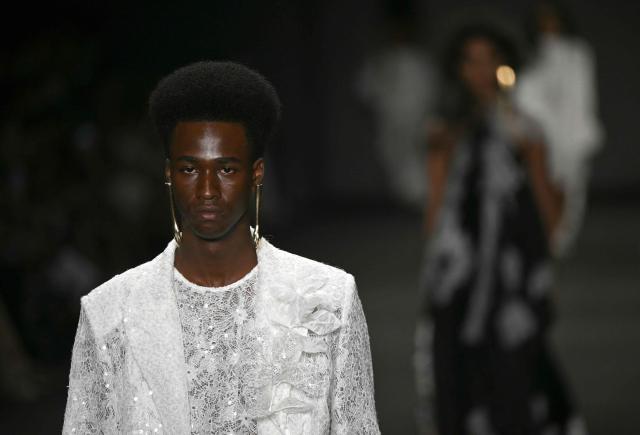 A model presents a creation by Apartamento 03 during Rio Fashion Week at Pier Maua in Rio de Janeiro, Brazil, on April 17, 2026. (Photo by Mauro PIMENTEL / AFP)