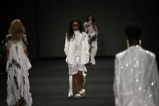 Models present creations by Apartamento 03 during Rio Fashion Week at Pier Maua in Rio de Janeiro, Brazil, on April 17, 2026. (Photo by Mauro PIMENTEL / AFP)