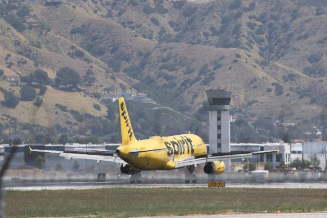 A Spirit Airlines Airbus A320 lands at Hollywood Burbank Airport on April 17, 2026. Spirit Airlines has been facing financial troubles, while rising jet fuel due to the war in Iran has amplified their worries. (Photo by Patrick T. Fallon / AFP)