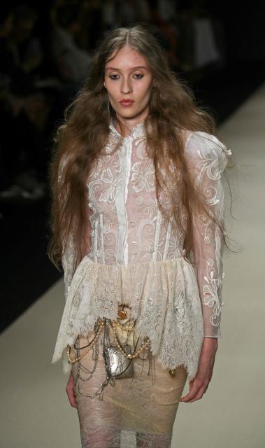 A model presents a creation by Helo Rocha during Rio Fashion Week at Pier Maua in Rio de Janeiro, Brazil, on April 17, 2026. (Photo by Mauro PIMENTEL / AFP)