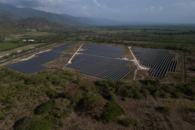 Aerial view of the solar park in Zona Bananera, Prado Sevilla, Magdalena department, Colombia on April 17, 2026. Co-organised by the governments of Colombia and the Netherlands, the first conference on the transition away from fossil fuels will be held in Santa Marta on April 28 and 29, 2026, with representatives of more than 50 countries attending. (Photo by Luis Acosta / AFP)
