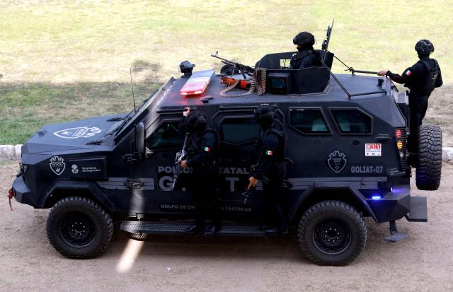 Jalisco state police officers attend a drill during the closing ceremony of the Urban Tactical Operations Course in Tlaquepaque, Jalisco, Mexico on April 17, 2026. The Urban Tactical Operations Course in conjunction with Colombian Police was part of the 2026 FIFA World Cup security preparations. (Photo by ULISES RUIZ / AFP)
