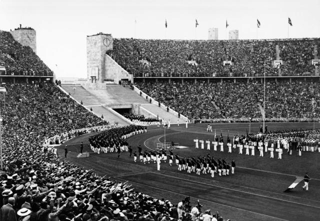 (FILES) The French delegation marches through the new 100 000 seat Berlin stadium as the crowd gives the nazi salute during the opening ceremony of the Berlin 1936 Olympic Games on August 1, 1936 in Berlin. On April 19, 2026, voters in Germany's Rhine/Ruhr region will be the latest to have their say on a possible bid to host the Summer Olympics in either 2036, 2040 or 2044.
Around four million voters in the former German industrial heartland are expected to cast their ballots, six months after a similar initiative was successfully put to a vote in Munich. (Photo by AFP)