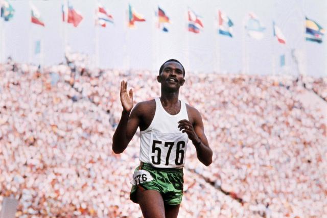 (FILES) Kipchoge Keino waves to crowd after crossing the finish line in the men's 3000m steeplechase final at the athletics event during the Munich 1972 Olympic Games on September 5, 1972 in Munich. On April 19, 2026, voters in Germany's Rhine/Ruhr region will be the latest to have their say on a possible bid to host the Summer Olympics in either 2036, 2040 or 2044.
Around four million voters in the former German industrial heartland are expected to cast their ballots, six months after a similar initiative was successfully put to a vote in Munich. (Photo by AFP)