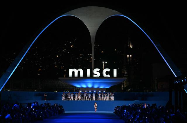A model presents a creation by Misci during Rio Fashion Week at Marques de Sapucai sambadrome in Rio de Janeiro, Brazil on April 17, 2026. (Photo by Mauro PIMENTEL / AFP)