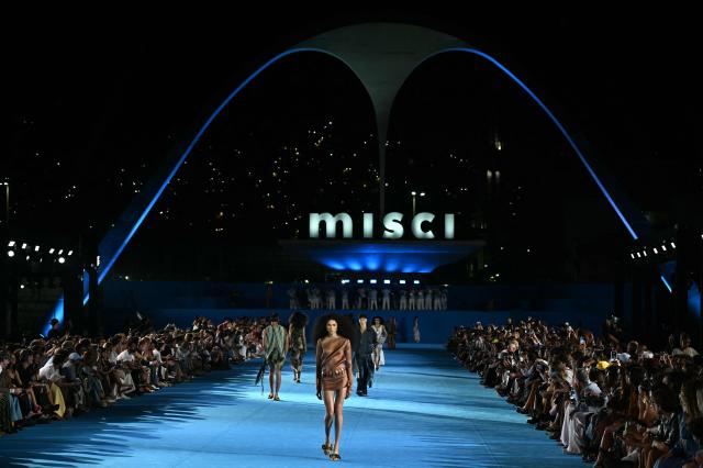 A model presents a creation by Misci during Rio Fashion Week at Marques de Sapucai sambadrome in Rio de Janeiro, Brazil on April 17, 2026. (Photo by Mauro PIMENTEL / AFP)