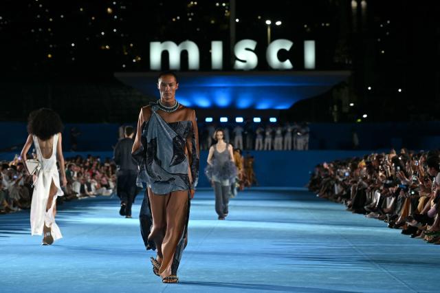 A model presents a creation by Misci during Rio Fashion Week at Marques de Sapucai sambadrome in Rio de Janeiro, Brazil on April 17, 2026. (Photo by Mauro PIMENTEL / AFP)