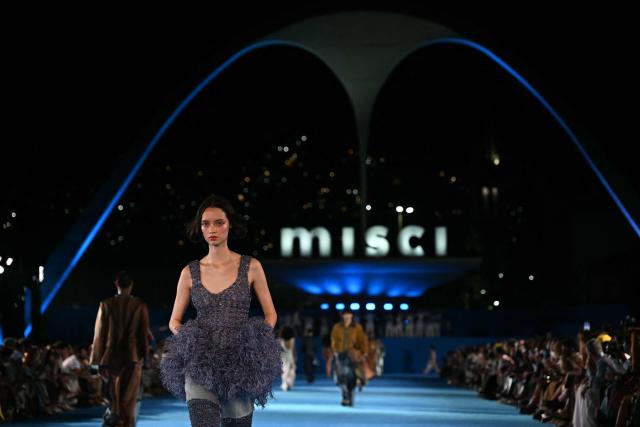 A model presents a creation by Misci during Rio Fashion Week at Marques de Sapucai sambadrome in Rio de Janeiro, Brazil on April 17, 2026. (Photo by Mauro PIMENTEL / AFP)