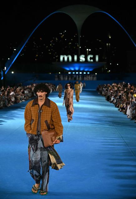 A model presents a creation by Misci during Rio Fashion Week at Marques de Sapucai sambadrome in Rio de Janeiro, Brazil on April 17, 2026. (Photo by Mauro PIMENTEL / AFP)