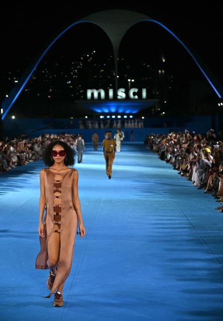 A model presents a creation by Misci during Rio Fashion Week at Marques de Sapucai sambadrome in Rio de Janeiro, Brazil on April 17, 2026. (Photo by Mauro PIMENTEL / AFP)