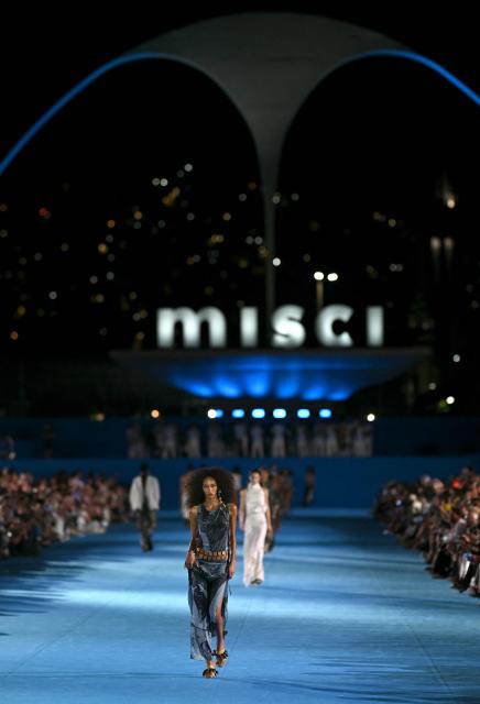 A model presents a creation by Misci during Rio Fashion Week at Marques de Sapucai sambadrome in Rio de Janeiro, Brazil on April 17, 2026. (Photo by Mauro PIMENTEL / AFP)