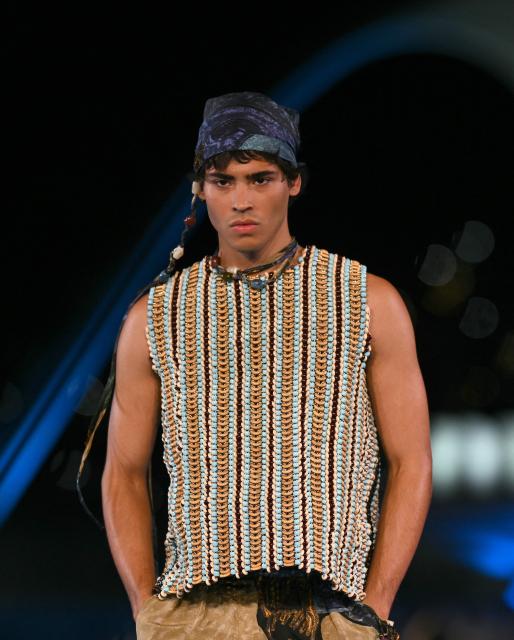 A model presents a creation by Misci during Rio Fashion Week at Marques de Sapucai sambadrome in Rio de Janeiro, Brazil on April 17, 2026. (Photo by Mauro PIMENTEL / AFP)
