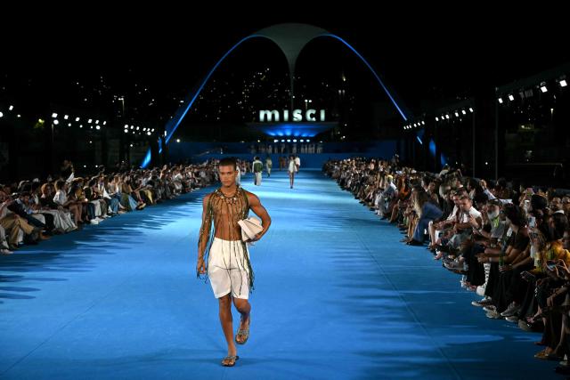 A model presents a creation by Misci during Rio Fashion Week at Marques de Sapucai sambadrome in Rio de Janeiro, Brazil on April 17, 2026. (Photo by Mauro PIMENTEL / AFP)