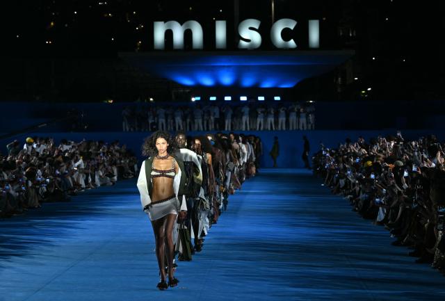 A model presents a creation by Misci during Rio Fashion Week at Marques de Sapucai sambadrome in Rio de Janeiro, Brazil on April 17, 2026. (Photo by Mauro PIMENTEL / AFP)