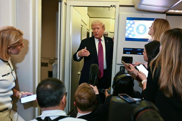 US President Donald Trump speaks to the press aboard Air Force One before arriving at Joint Base Andrews in Maryland on April 17, 2026 after a two-day trip to Nevada and Arizona. (Photo by Jim WATSON / AFP)