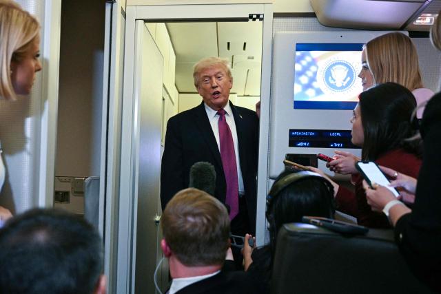 US President Donald Trump speaks to the press aboard Air Force One before arriving at Joint Base Andrews in Maryland on April 17, 2026 after a two-day trip to Nevada and Arizona. (Photo by Jim WATSON / AFP)