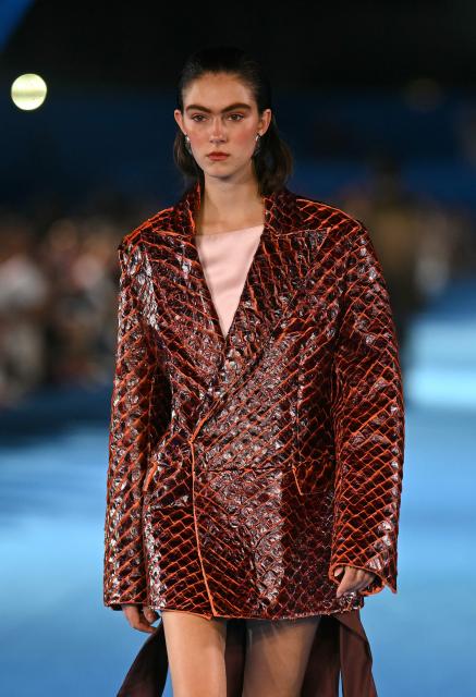 A model presents a creation by Misci during Rio Fashion Week at Marques de Sapucai sambadrome in Rio de Janeiro, Brazil on April 17, 2026. (Photo by Mauro PIMENTEL / AFP)
