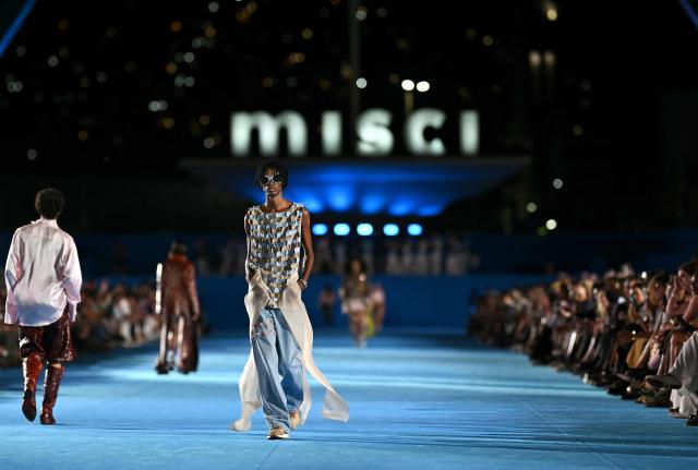 A model presents a creation by Misci during Rio Fashion Week at Marques de Sapucai sambadrome in Rio de Janeiro, Brazil on April 17, 2026. (Photo by Mauro PIMENTEL / AFP)