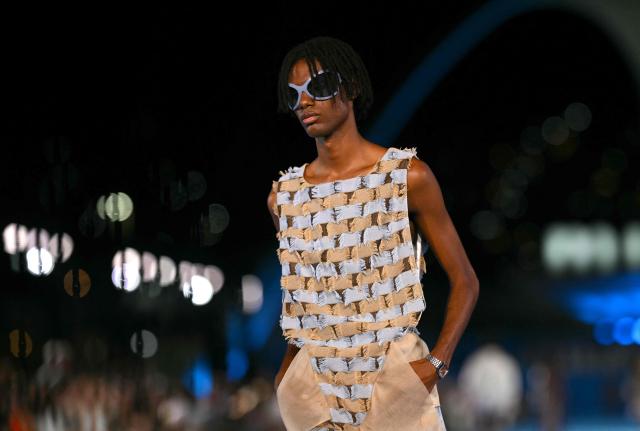 A model presents a creation by Misci during Rio Fashion Week at Marques de Sapucai sambadrome in Rio de Janeiro, Brazil on April 17, 2026. (Photo by Mauro PIMENTEL / AFP)