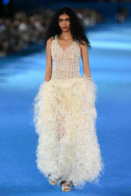 A model presents a creation by Misci during Rio Fashion Week at Marques de Sapucai sambadrome in Rio de Janeiro, Brazil on April 17, 2026. (Photo by Mauro PIMENTEL / AFP)