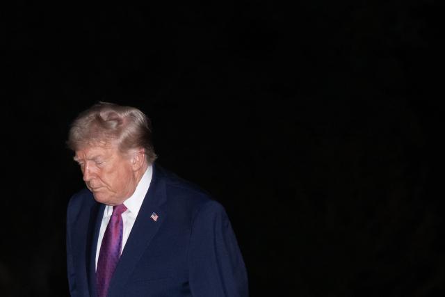 US President Donald Trump walks on the South Lawn after arriving on Marine One at the White House in Washington, DC, April 17, 2026, following a trip to Nevada and Arizona. (Photo by SAUL LOEB / AFP)