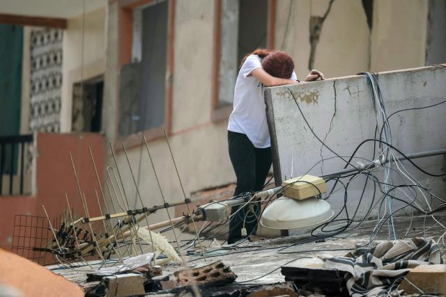 A displaced woman reacts after returning to her damaged home in Beirut’s southern suburbs on April 18, 2026. Israel and Lebanon agreed to a 10-day ceasefire on April 16 in order to negotiate an end to six weeks of war between Israel and the Iran-backed group Hezbollah. The conflict saw massive Israeli airstrikes across Lebanon and also a ground invasion in the south. (Photo by ibrahim AMRO / AFP)