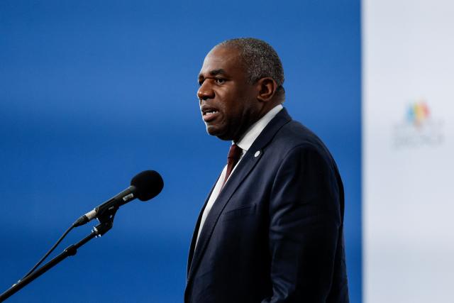 Britain's Deputy Prime Minister and Justice Secretary David Lammy speaks to reporters before a "Meeting in Defence of Democracy", a meeting of leftist leaders seeking to rally against the threat to democracy from the far right in Barcelona on April 18, 2026. The gathering comes as democratic institutions and values have faced growing threats around the globe from advancing authoritarian and far-right forces in the age of US President Donald Trump. Many of the participants will take part in the first edition of the so-called "Global Progressive Mobilisation" which will be held in the same venue. (Photo by Oscar DEL POZO / AFP)