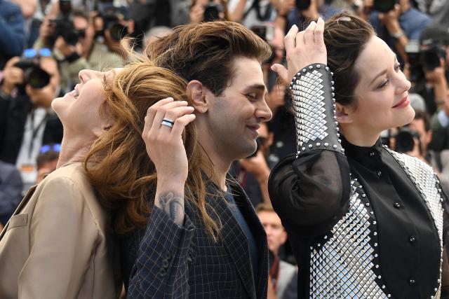 (FILES) (FromL) French actress Nathalie Baye, Canadian director Xavier Dolan and French actress Marion Cotillard pose on May 19, 2016 during a photocall for the film "It's Only The End Of The World (Juste La Fin Du Monde)" at the 69th Cannes Film Festival in Cannes, southern France. Nathalie Baye, 77, passed away on April 17, 2026, announced her family to Agence France-Presse on April 18, 2026. (Photo by ANNE-CHRISTINE POUJOULAT / AFP)