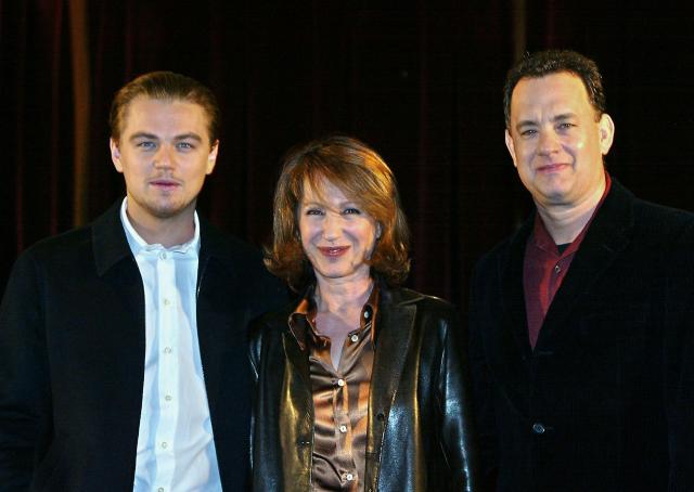(FILES) (From L-R:) US actor Leonardo DiCaprio, French actress Nathalie Baye and US actor Tom Hanks pose during the presentation to the press of Steven Spielberg's movie "Catch me if you can" in Paris on January 28, 2003. Nathalie Baye, 77, passed away on April 17, 2026, announced her family to Agence France-Presse on April 18, 2026. (Photo by Jack GUEZ / AFP)