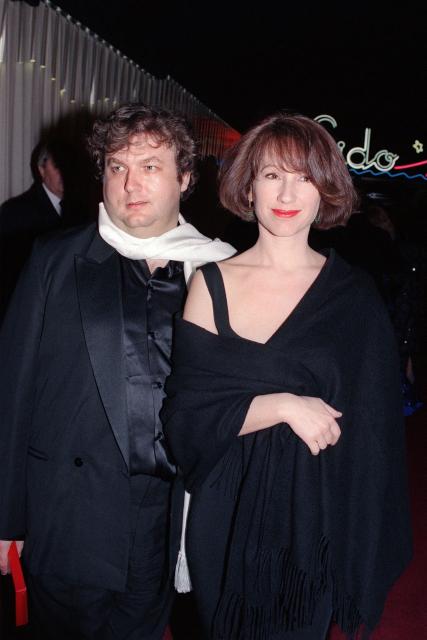 (FILES) French actress Nathalie Baye (R) and her artistic agent Dominique Besnehard attend the new revue of the Lido cabaret in Paris on March 14, 1990. Nathalie Baye, 77, passed away on April 17, 2026, announced her family to Agence France-Presse on April 18, 2026. (Photo by MICHEL GANGNE / AFP)