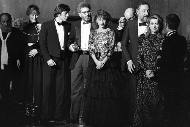 (FILES) 2nd-R to L, French actress Catherine Deneuve, ceremonial president, French actor Philippe Noiret, French actress Nathalie Baye, US film director Bob Swaim, French actor Bernard Giraudeau, US actress Meryl Streep and French sculptor César pose during the eighth ceremony of the Césars award ceremony at the "Grand Rex" in Paris on February 26, 1983. Nathalie Baye, 77, passed away on April 17, 2026, announced her family to Agence France-Presse on April 18, 2026. (Photo by PHILIPPE WOJAZER / AFP)
