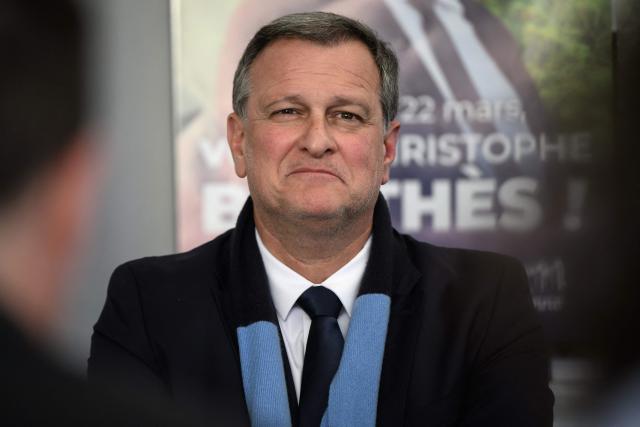 (FILES) Mayor of Perpignan and Vice President of the far-right party Rassemblement National (RN) Louis Aliot (C) holds a press conference at the campaign office of Christophe Barthès, Rassemblement National (RN) candidate for mayor in Carcassonne on March 18, 2026. Far-right party Rassemblement National (RN) Louis Aliot was elected president of the urban community on April 18, 2026, making it the largest now led by the far-right party. (Photo by Ed JONES / AFP)