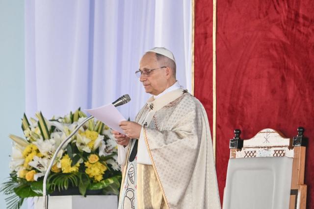 Pope Leo XIV delivers his homily as he leads a Holy Mass at the Yaounde Ville Airport in Yaounde on the sixth day of an 11-day apostolic journey to Africa, on April 18, 2026. (Photo by Alberto PIZZOLI / AFP)