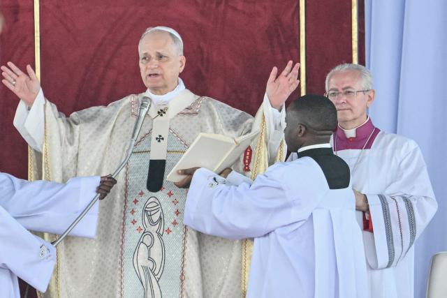 Pope Leo XIV leads a Holy Mass at the Yaounde Ville Airport in Yaounde on the sixth day of an 11-day apostolic journey to Africa, on April 18, 2026. (Photo by Alberto PIZZOLI / AFP)