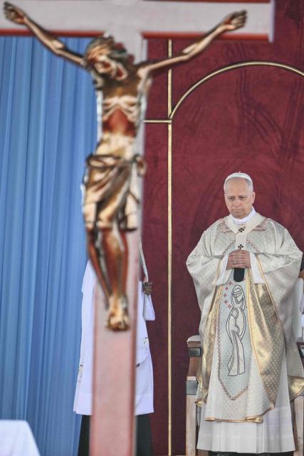 Pope Leo XIV leads a Holy Mass at the Yaounde Ville Airport in Yaounde on the sixth day of an 11-day apostolic journey to Africa, on April 18, 2026. (Photo by Alberto PIZZOLI / AFP)