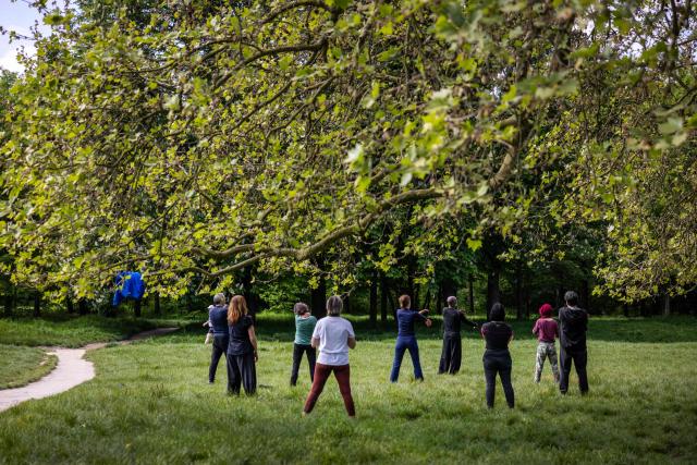 People exercise at the Bois de Vincennes park in Paris on April 18, 2026. (Photo by Behrouz MEHRI / AFP)