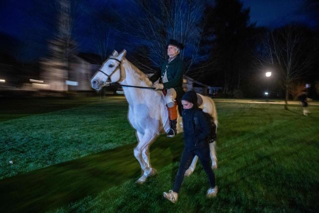 A Lexington Minute Men reenactor rides a horse during a battle reenactment of the Battle of Lexington and Concord as part of Patriot's Day celebrations in Lexington, Massachusetts, on April 18, 2026. April 19, 2026 marks the 250th anniversary of the Battle of Lexington and Concord, the first major military actions between the British Army and the Colonial American militias during the American Revolutionary War. (Photo by Joseph Prezioso / AFP)