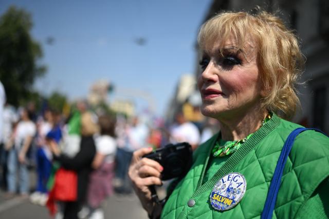 A supporter of Italian far-right party Lega takes part in a rally organized by the Patriots for Europe group (PfE) at the European Parliament and titled “Without Fear: in Europe, masters in our own home,” in Milan on April 18, 2026. (Photo by PIERO CRUCIATTI / AFP)