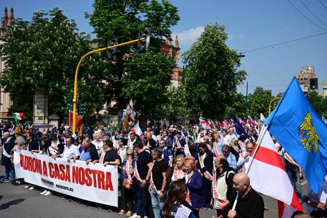 People march during a rally organized by the Patriots for Europe group (PfE) at the European Parliament and titled “Without Fear: in Europe, masters in our own home,” in Milan on April 18, 2026. (Photo by PIERO CRUCIATTI / AFP)